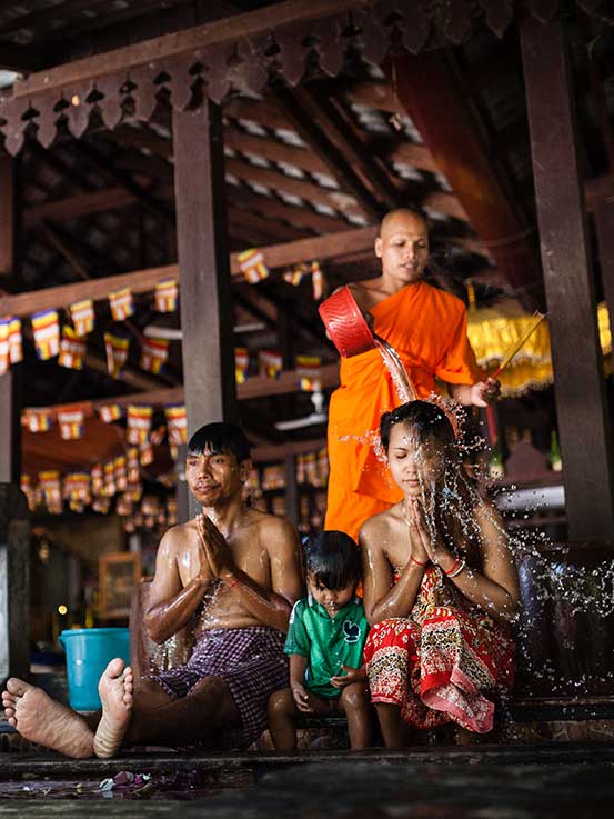 a-sacred-Buddhist-blessing-at-the-serene-Wat-Athvea-temple-Siem-Reap-By-Sala-Lodges Woman walking up steps to room at Sala Lodges