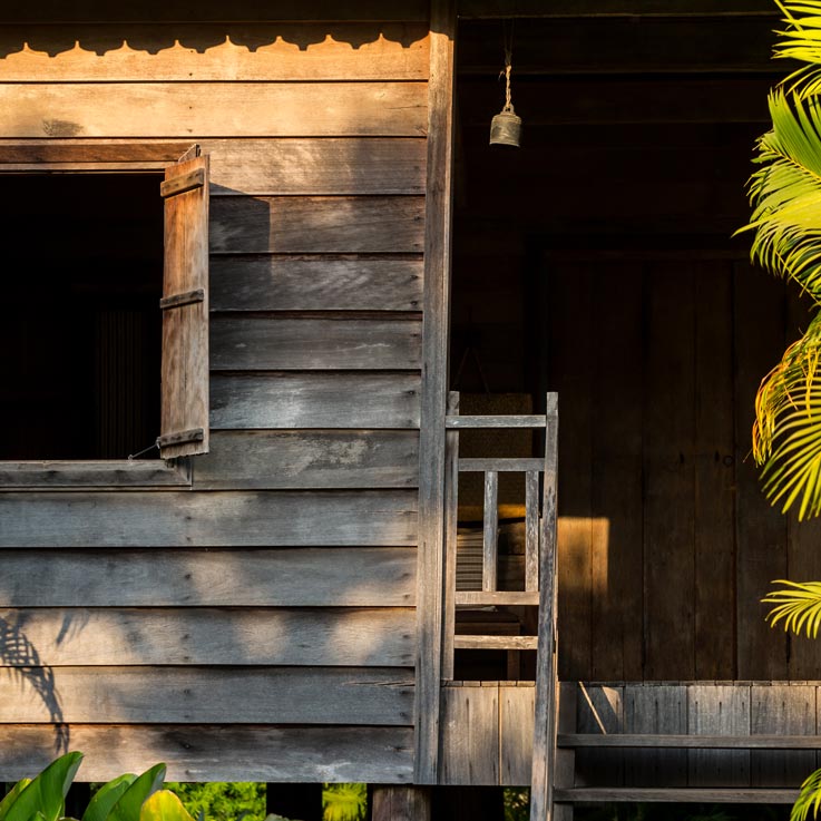 Woman walking up steps to room at Sala Lodges