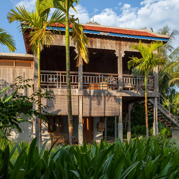 Woman walking up steps to room at Sala Lodges