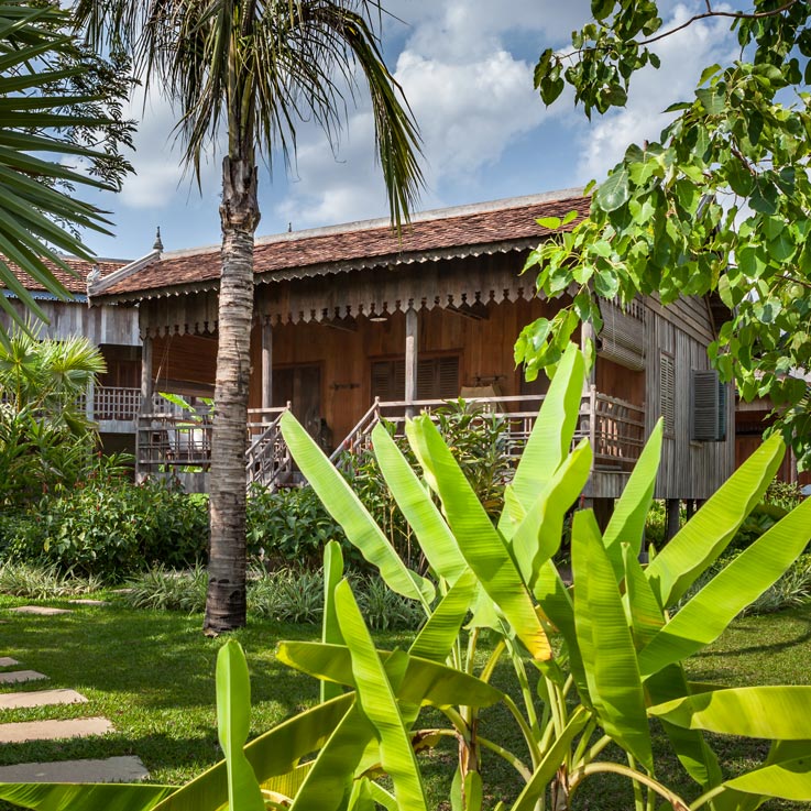 Woman walking up steps to room at Sala Lodges