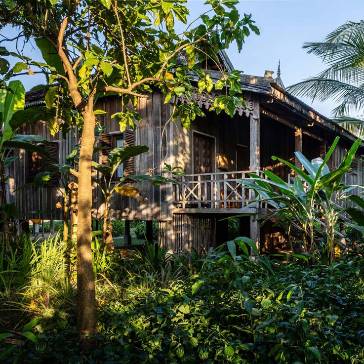 Woman walking up steps to room at Sala Lodges