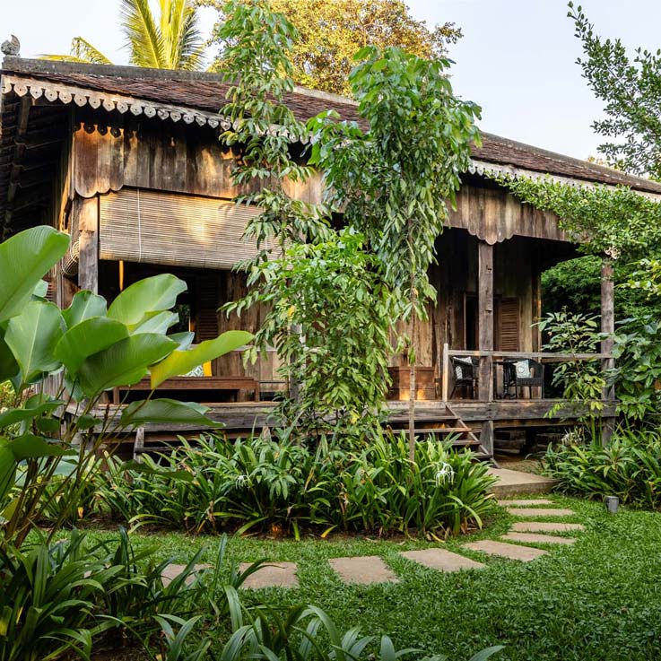 Woman walking up steps to room at Sala Lodges