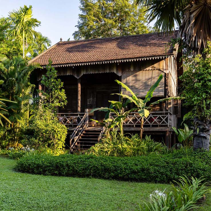 Woman walking up steps to room at Sala Lodges