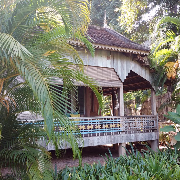 Woman walking up steps to room at Sala Lodges