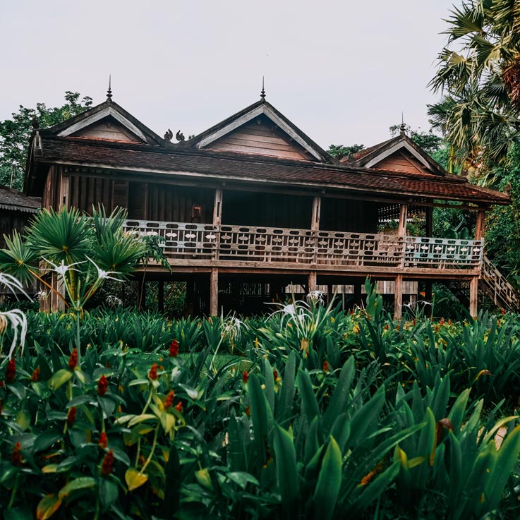 Woman walking up steps to room at Sala Lodges