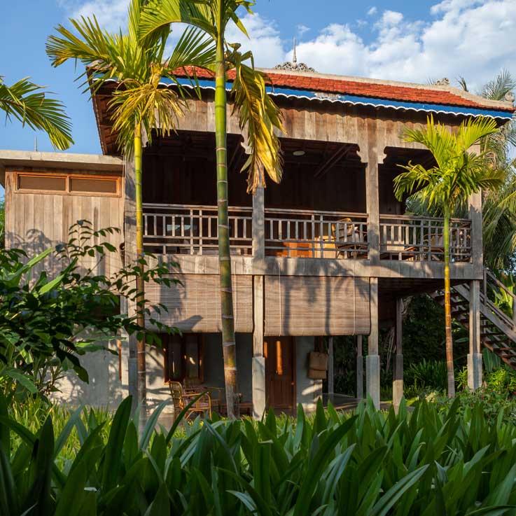 Woman walking up steps to room at Sala Lodges