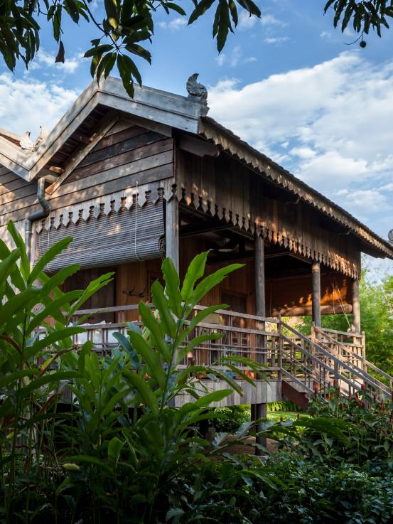 Woman walking up steps to room at Sala Lodges