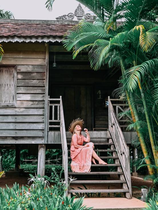 Woman walking up steps to room at Sala Lodges