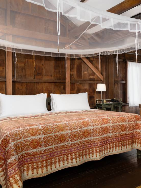 Woman walking up steps to room at Sala Lodges