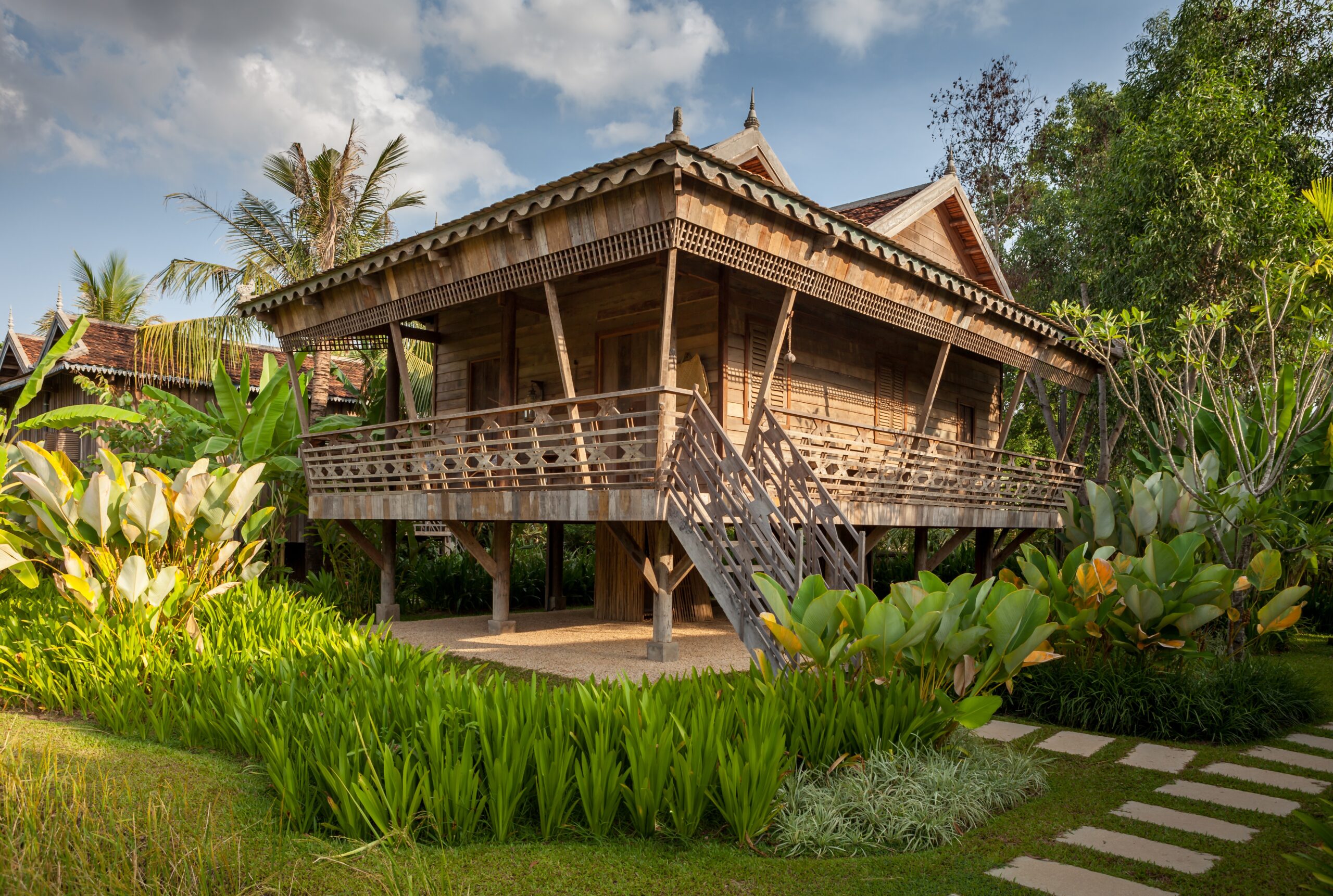Woman walking up steps to room at Sala Lodges
