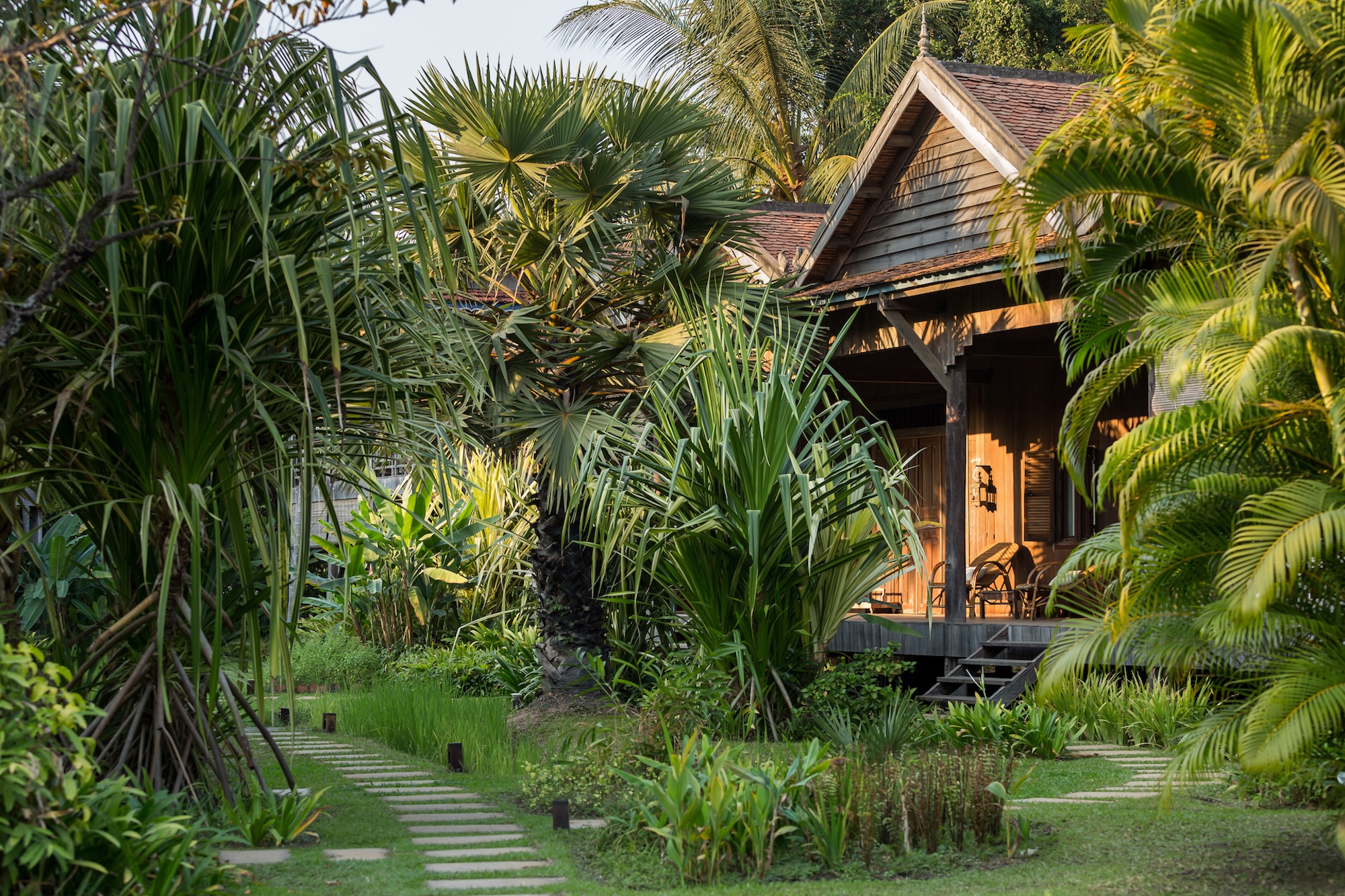 Woman walking up steps to room at Sala Lodges